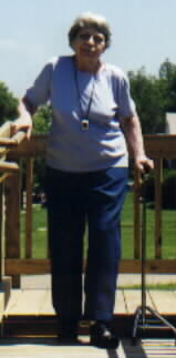 woman with cane on steps