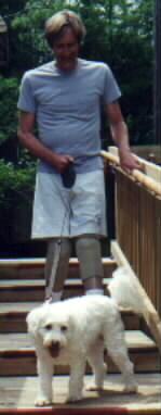 man with dog on steps