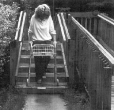 woman with walker on broad stairs